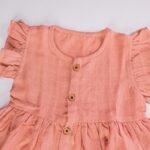 Peach Muslin Baby Frock with Wooden Buttons – Soft & Stylish - Image 2