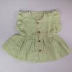 Pista Green Muslin Baby Frock with Wooden Buttons – Soft & Stylish